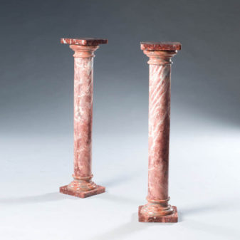 A pair of marble columns & tazze