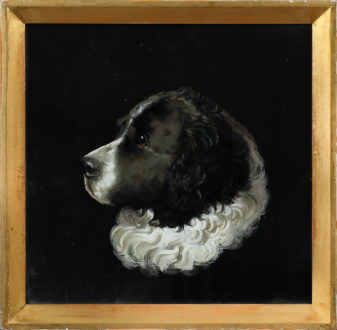 A charming pair of 19th century reverse glass dog portraits