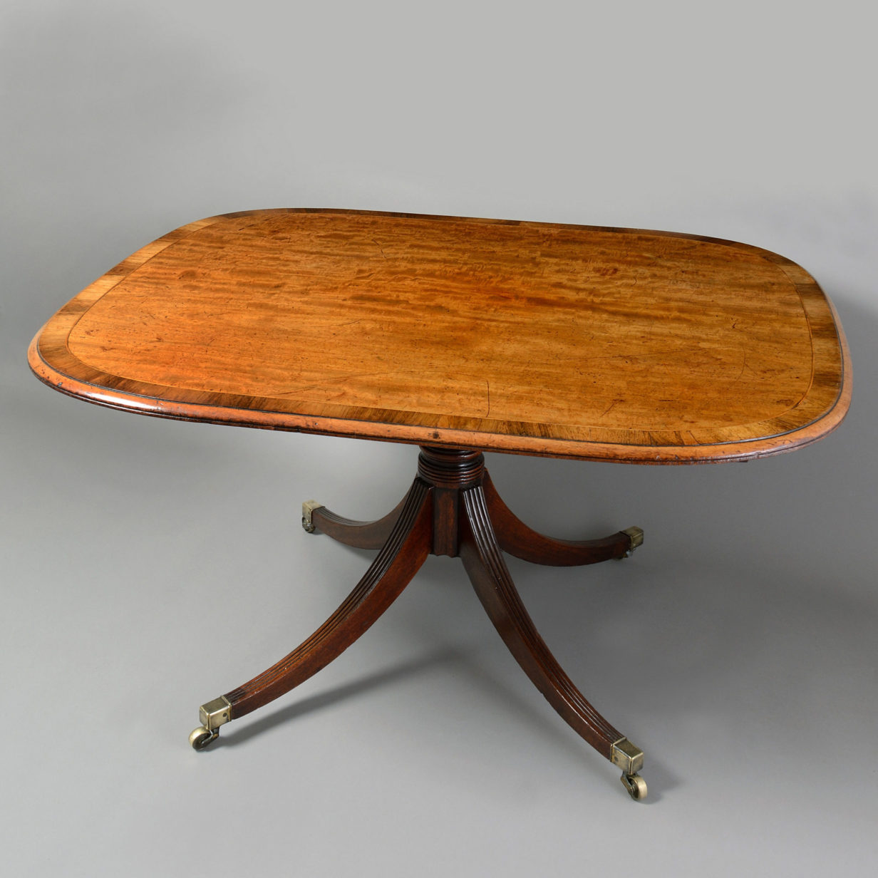 A regency period mahogany breakfast table