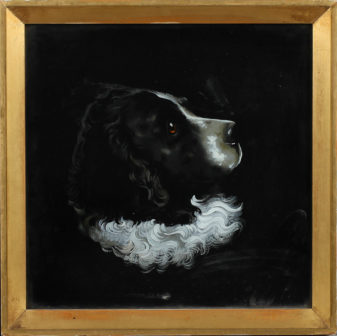 A charming pair of 19th century reverse glass dog portraits