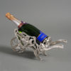 A late 19th century jugendstil silvered champagne wheel barrow