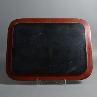 An early 19th century red japanned tray
