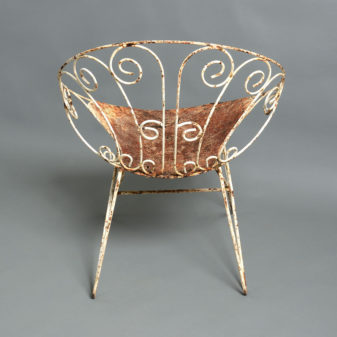 A pair of painted cast iron mid-century garden chairs