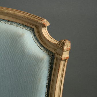 A pair of 19th century louis xvi style bergere armchairs