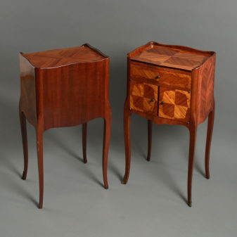 A pair of louis xv style bedside cabinets or night stands