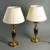 A pair of late 19th century empire style bronze and ormolu lamp bases