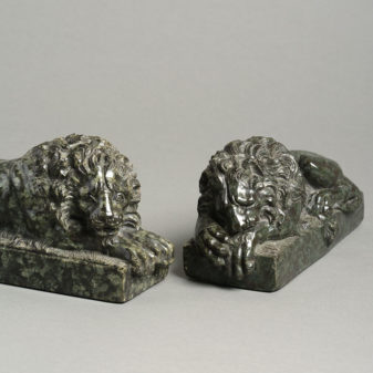 A pair of early 19th century serpentine marble canova lions