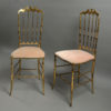 A stunning pair of mid-century brass side chairs