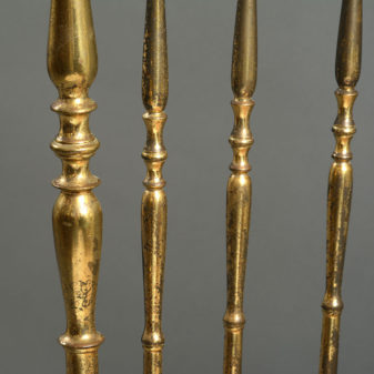 A stunning pair of mid-century brass side chairs