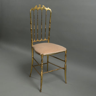 A stunning pair of mid-century brass side chairs