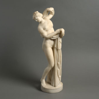A 19th century marble table statue of venus bathing