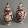 A large pair of 19th century imari vases and covers