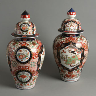 A large pair of 19th century imari vases and covers