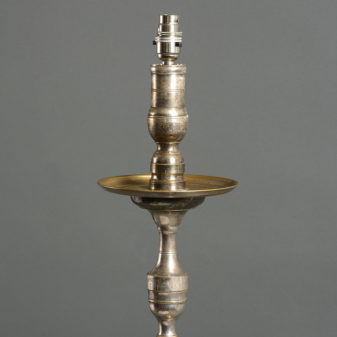 A mid-century silvered standing lamp in the early baroque taste