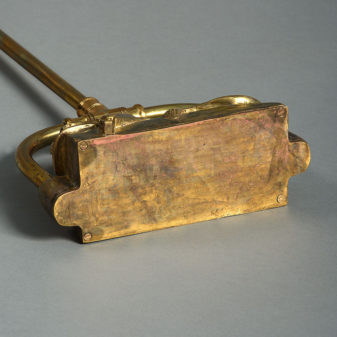 A tall 19th century brass door porter or doorstop