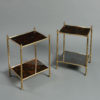 A pair of 20th century brass two tier end tables