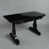 An early 19th century william iv period ebonised writing table