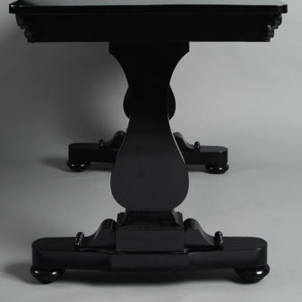 An early 19th century william iv period ebonised writing table