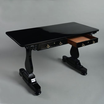 An early 19th century william iv period ebonised writing table