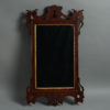 A mid-18th century george ii period mahogany fretwork mirror