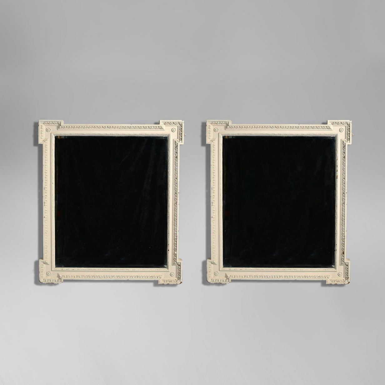 A large pair of william kent revival painted pier mirrors