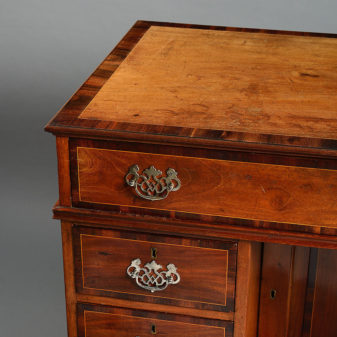 An 18th century colonial market kneehole desk