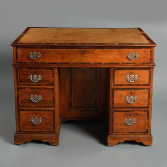 An 18th century colonial market kneehole desk