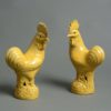 A 19th century pair of yellow glazed cockerels
