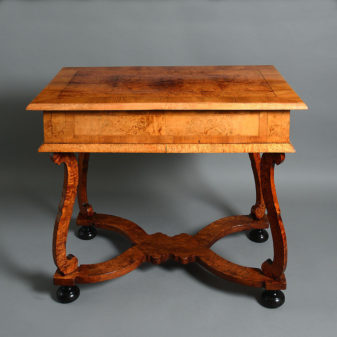 An early 18th century elm and ash side table