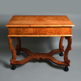 An early 18th century burr ash and elm side table