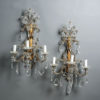 A pair of mid-20th century cut glass and gilt metal wall lights