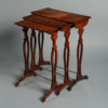 A late 18th century nest of three yew wood tables