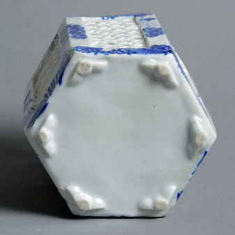 A pair of late 19th century porcelain tea light holders