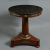 An early 19th century empire period mahogany centre table