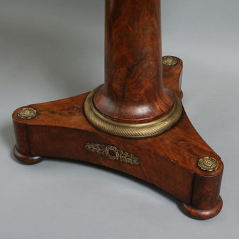 An early 19th century empire period mahogany centre table