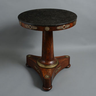 An early 19th century empire period mahogany centre table