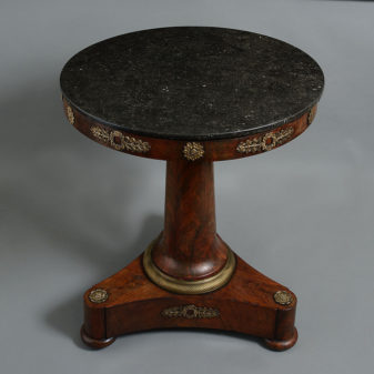 An early 19th century empire period mahogany centre table