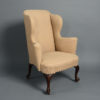 An early 18th century george i walnut wing armchair