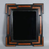 A 17th century walnut & ebonised geometric mirror