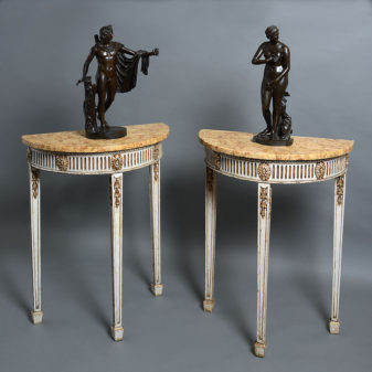 A pair of late 19th century adam style console tables