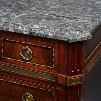 A 19th century directoire style walnut commode