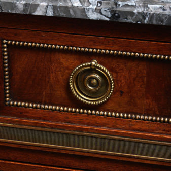 A 19th century directoire style walnut commode