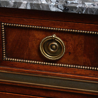 A 19th century directoire style walnut commode