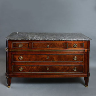 A 19th century directoire style walnut commode
