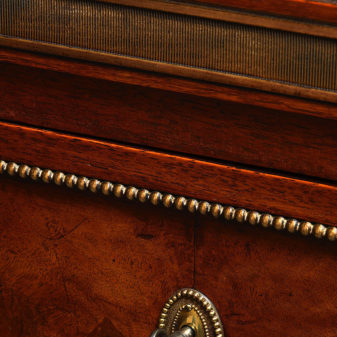 A 19th century directoire style walnut commode