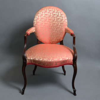 A pair from a set of four french hepplewhite mahogany armchairs