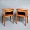 A pair of 20th century directoire style bedside tables