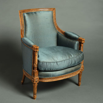 A pair of louis xvi style bergere armchairs