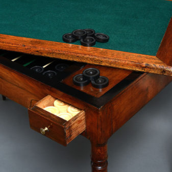 An 18th century directoire period walnut games or tric trac table