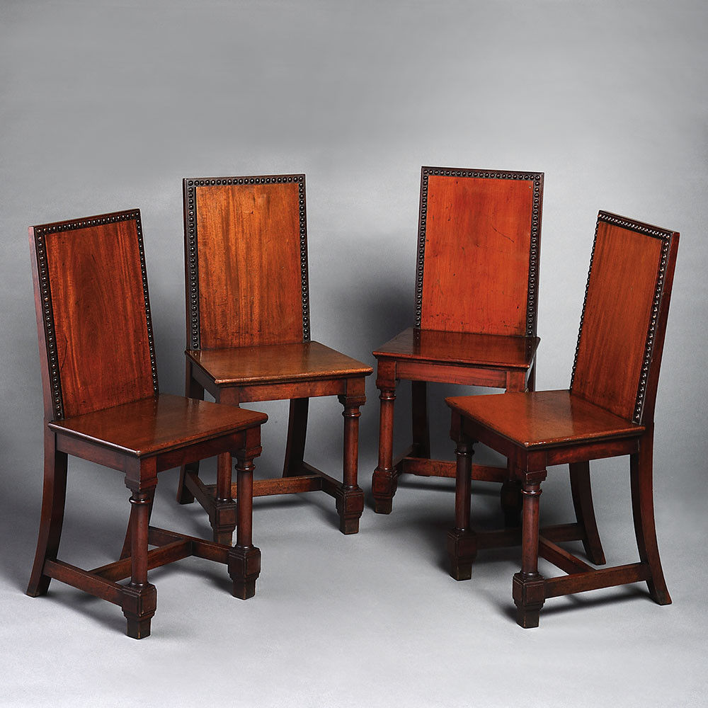 A set of four mahogany 19th century hall chairs